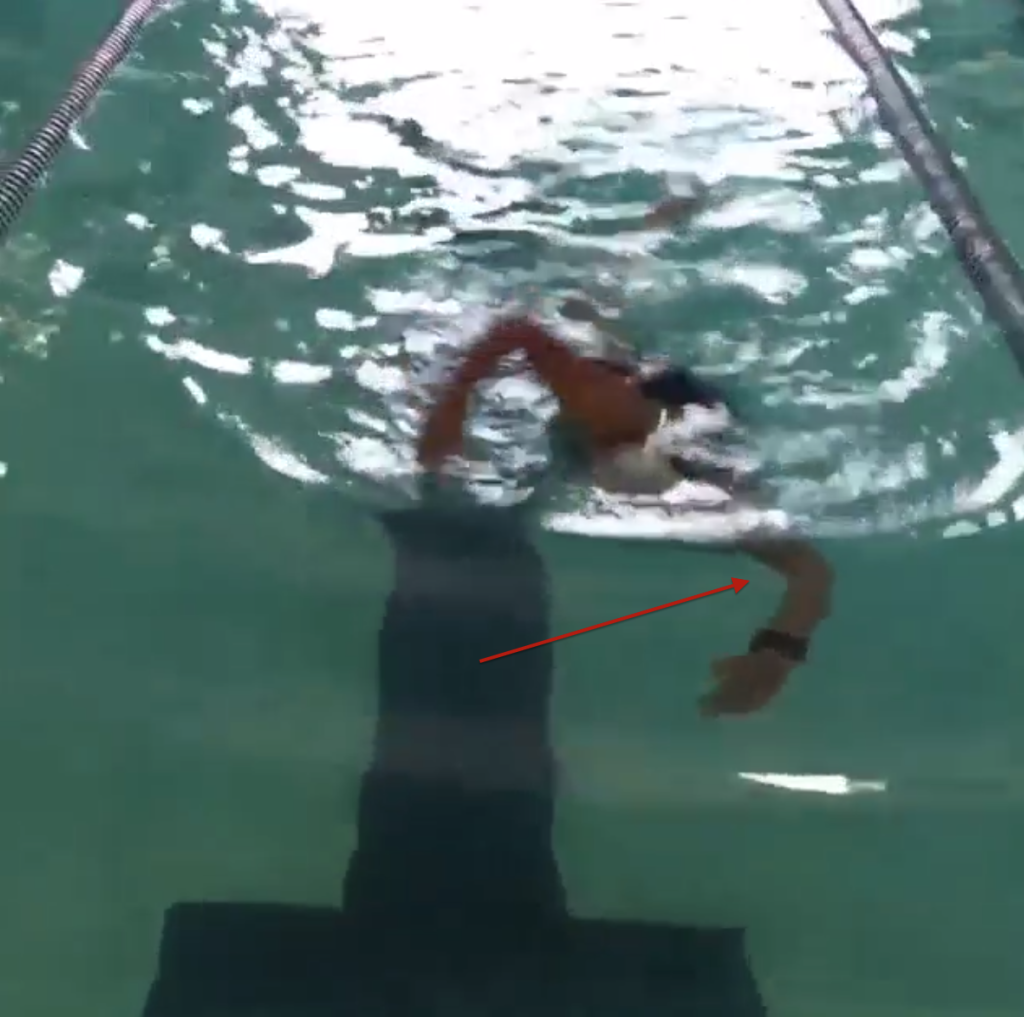 Front arm starting stroke too early instead of gliding further. 
